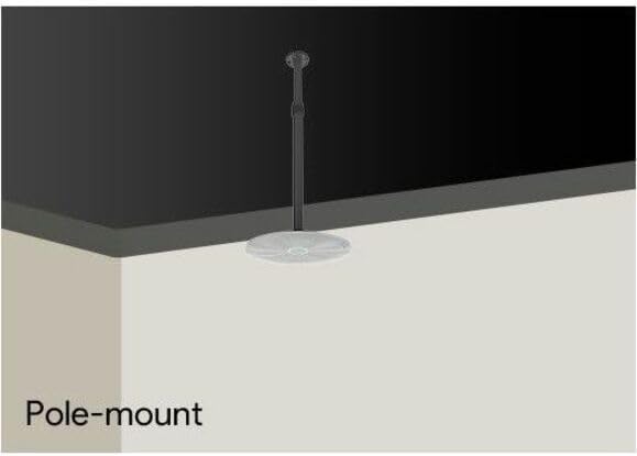 Pole-mounted ceiling speaker installation showing white round speaker suspended from ceilin
