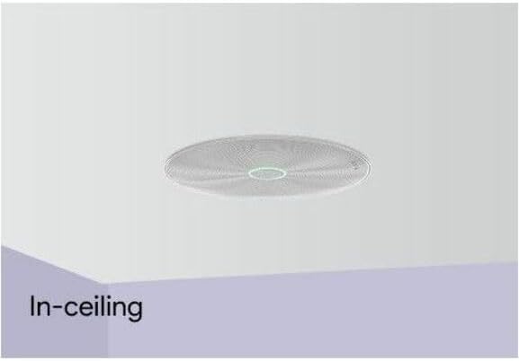 Round Pyle in-ceiling speaker with white grille and green mounting clips for flush home audio installation