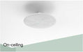 White on-ceiling speaker installed flush on ceiling for clean home audio setup