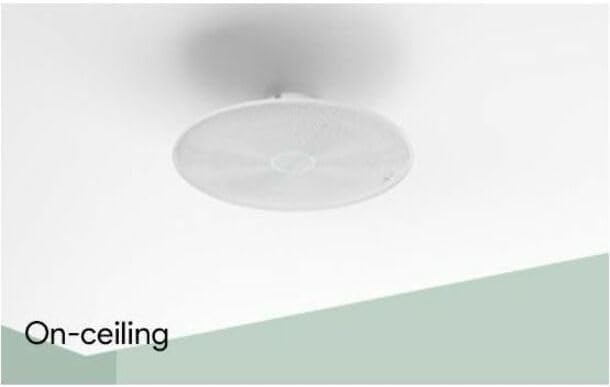 White on-ceiling speaker installed flush on ceiling for clean home audio setup
