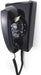 Black vintage corded telephone with classic keypad design for home or office decor.